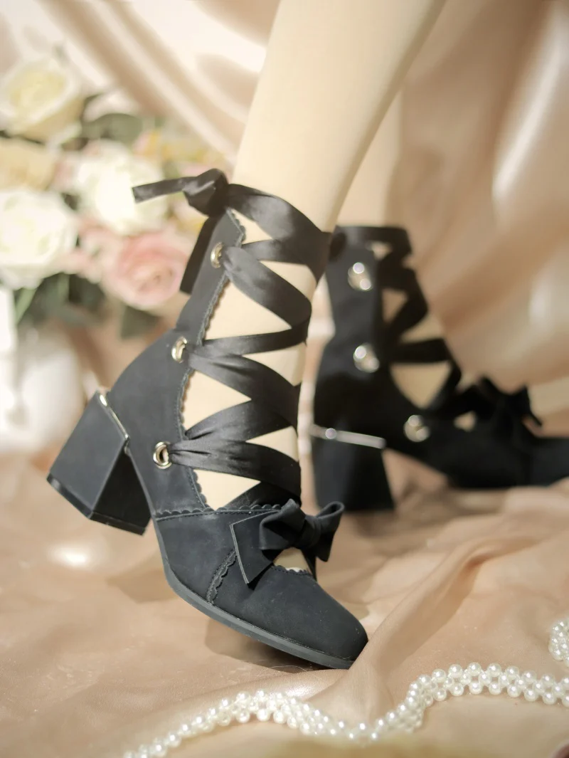 Black heels laced up with ribbon