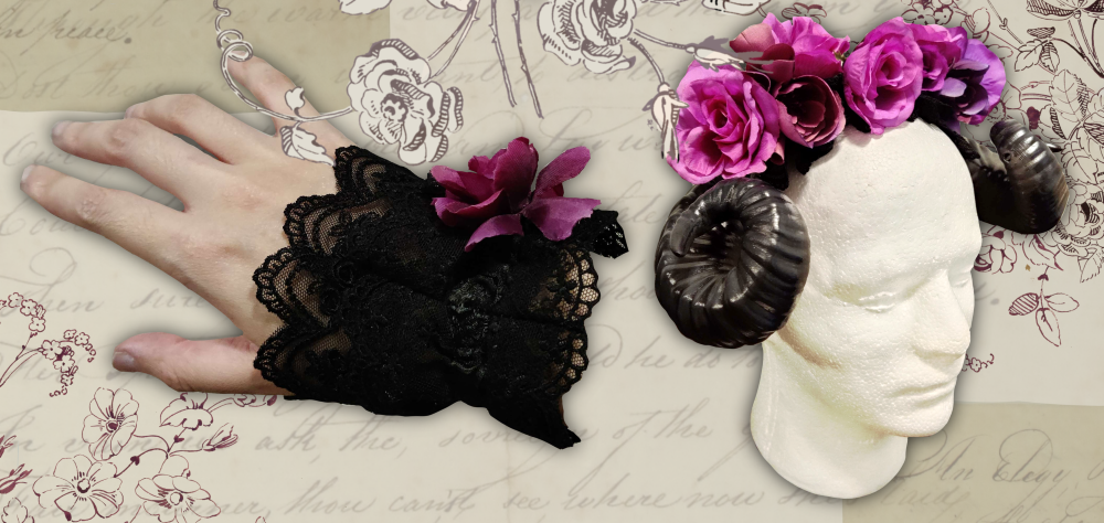 On the left: A black lolita wristcuff with a purple flower on it. On the right: A headpiece with curled black goathorns and a purple flower crown on a foam head.