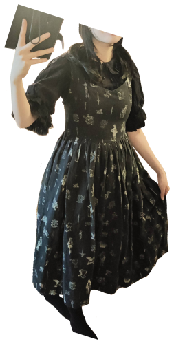 A casual outfit with a black blouse and black JSK with a knight pattern