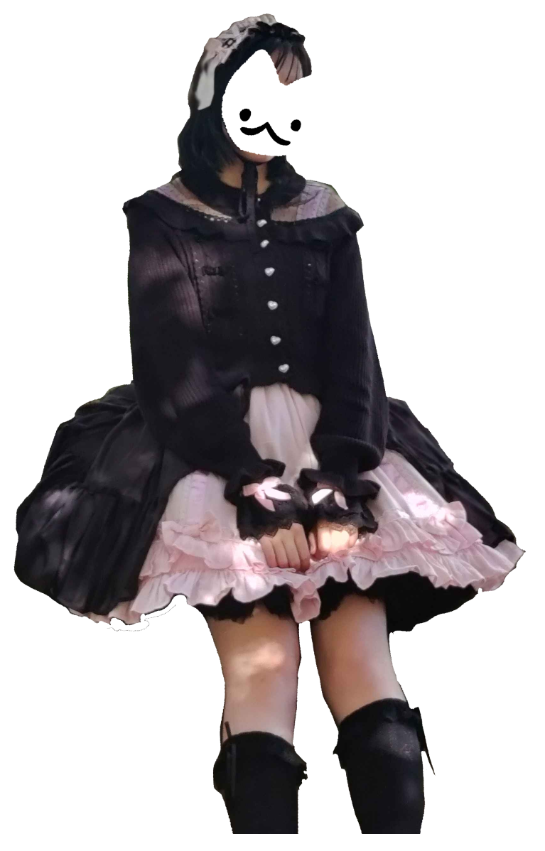 A coord with a pink JSK and black cardigan and overskirt
